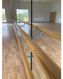 Double height wall fixed ballet barre